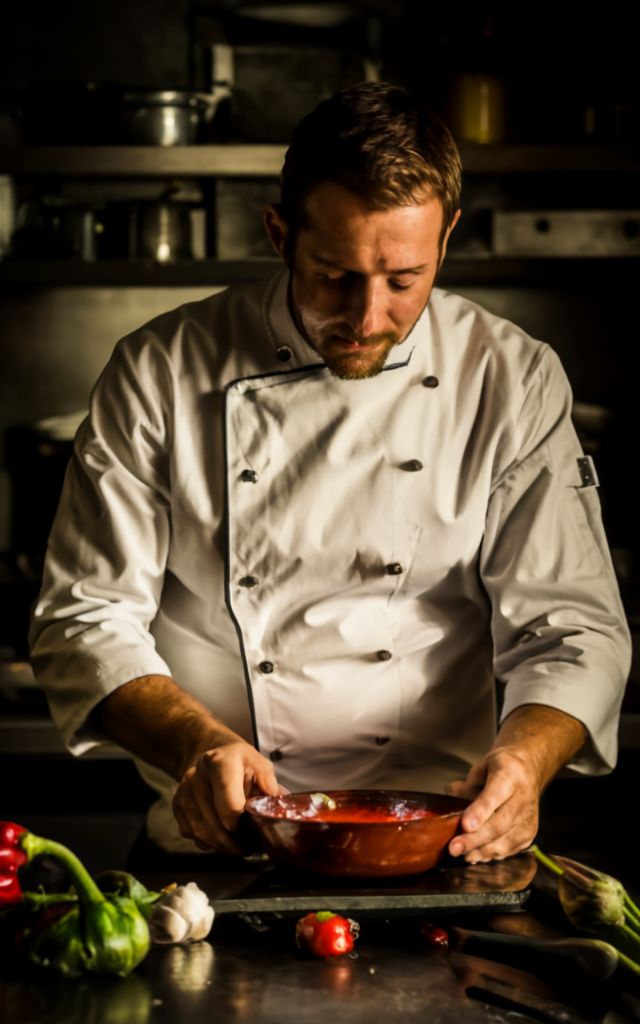 An Italian chef working on his tomato sauce
